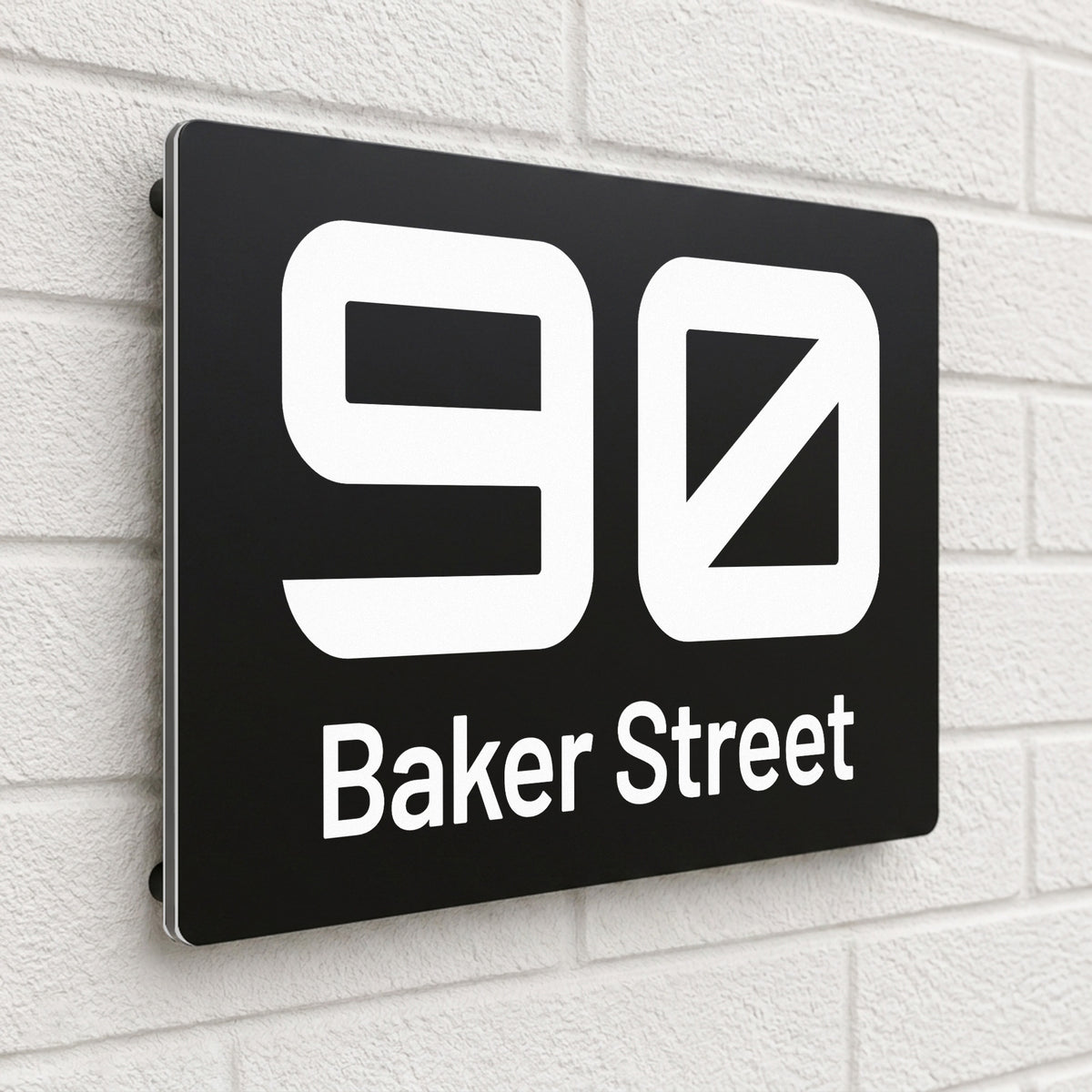 Black composite house sign personalised with '90 Baker Street' in a bold rounded typeface