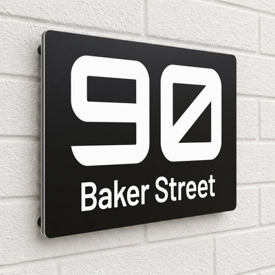 Black composite house sign personalised with '90 Baker Street' in a bold rounded typeface