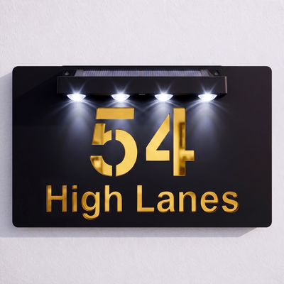 Black solar powered house sign glowing with mirror-effect LED text at night - SignStation