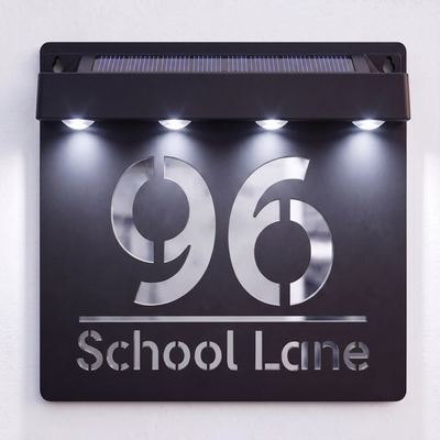 Personalised Black solar powered house sign shown with a custom house number and text